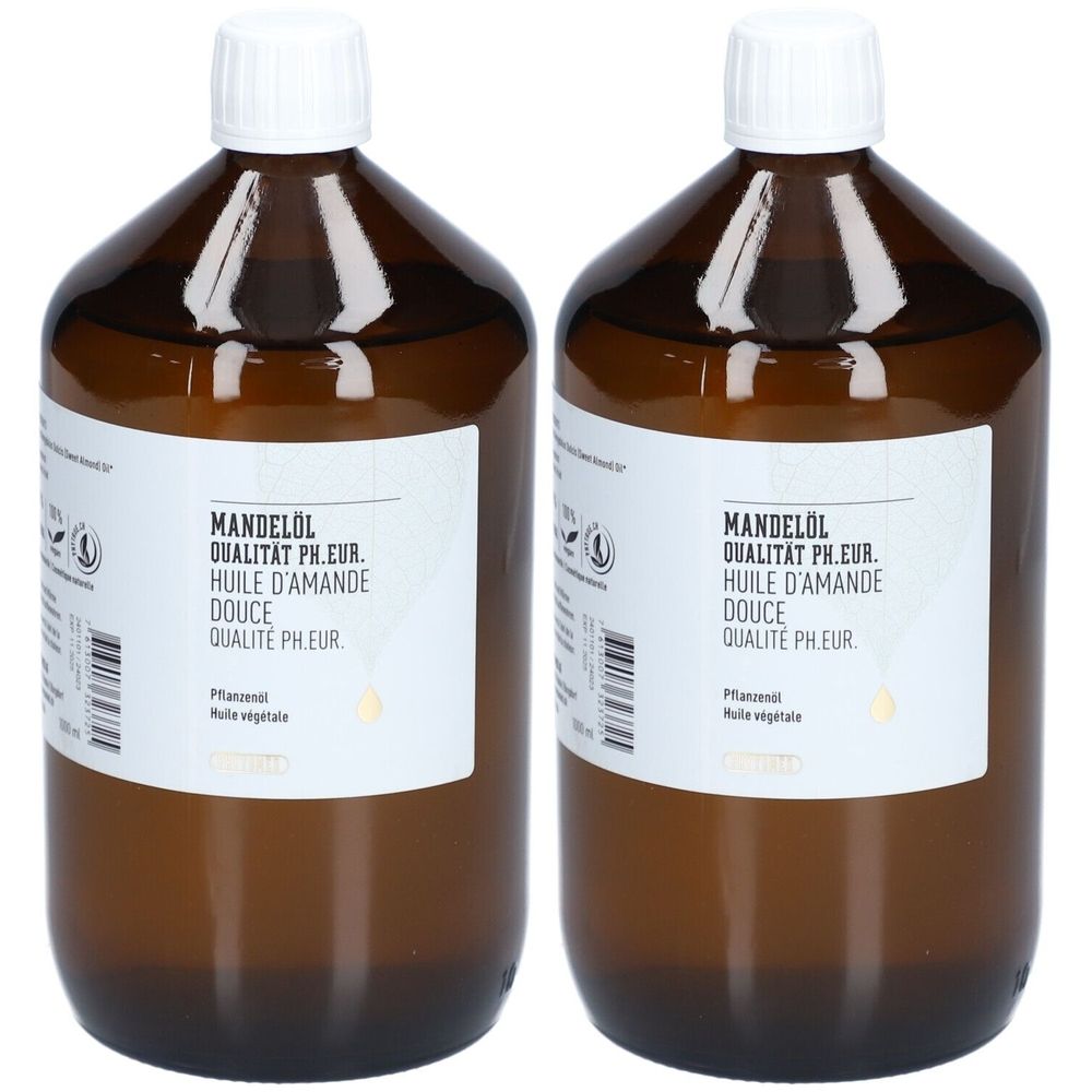 Twee bruine flessen met witte doppen. De etiketten tonen "Mandelöl Qualität Ph.Eur. Huile d'Amande Douce Qualité Ph.Eur.".