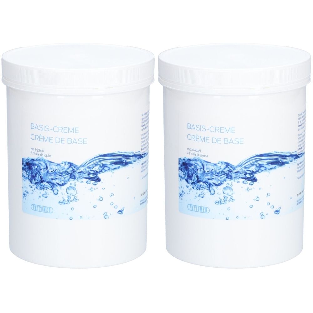 Twee witte potten met deksels. Opschrift: Basis-Creme, Crème de Base. Daaronder blauw watermotief. Merk: PHYTOMED.