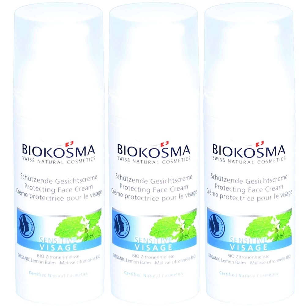 Drie witte flessen met etiketten. Opschrift: BIOKOSMA, beschermende gezichtscrème, Sensitive Visage. Met munt illustratie.
