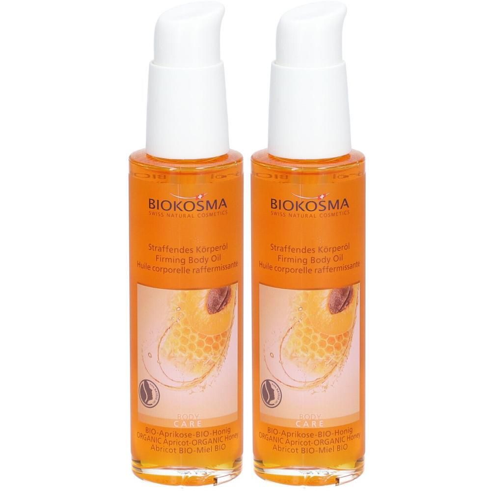 Twee flessen lichaamsolie met witte pompsluiting. Etiket met opschrift BIOKOSMA en productnaam.