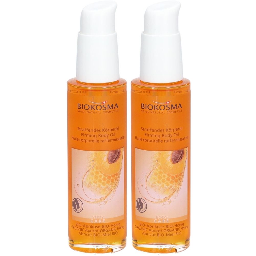 Twee flessen lichaamsolie met witte pompsluiting. Etiket met opschrift BIOKOSMA en productnaam.