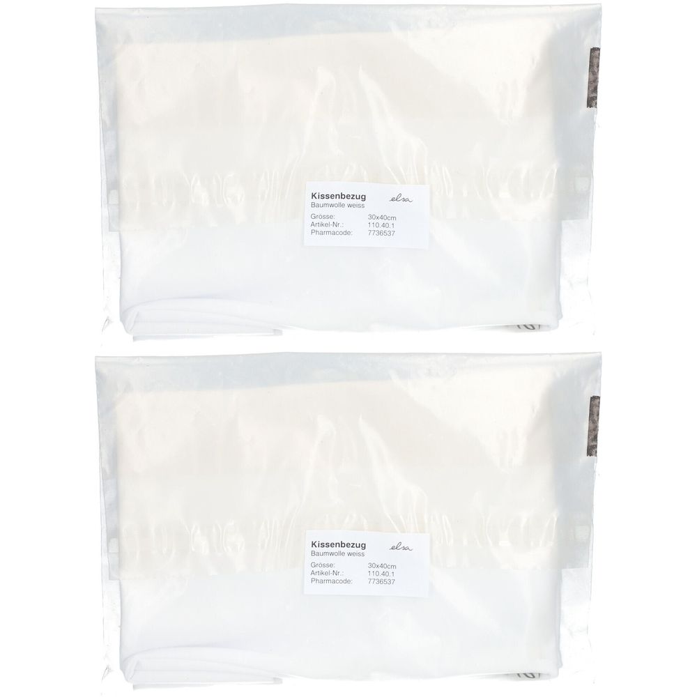 Twee witte kussenslopen in plastic verpakking. Etiket met productinformatie. Kussensloop van katoen.