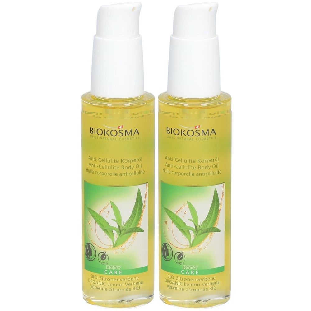 Twee flessen Biokosma Anti-Cellulite Body Oil. Gele vloeistof, witte pompkop, groene etiketten met plantenmotief en tekst.