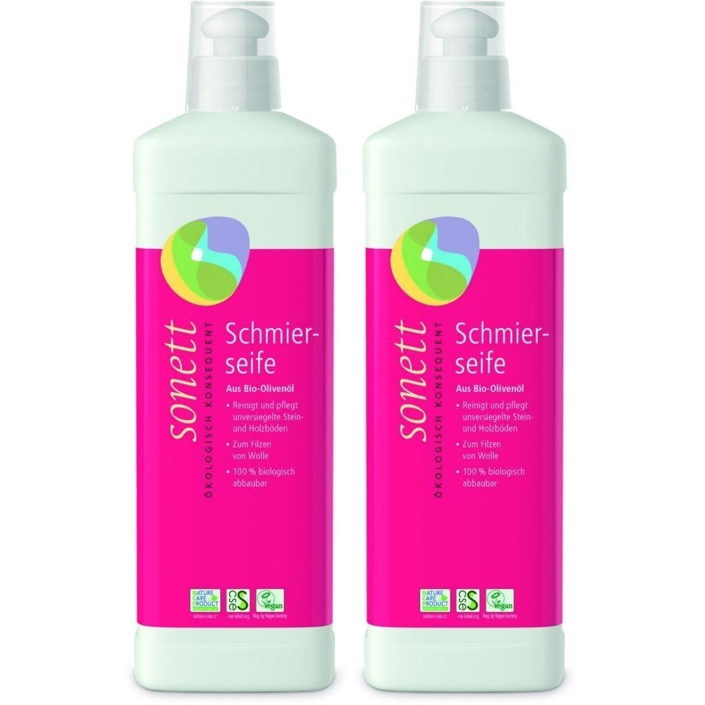 Deux bouteilles de savon noir Sonett. Bouteilles blanches avec étiquette rose. Logo et nom du produit visibles.