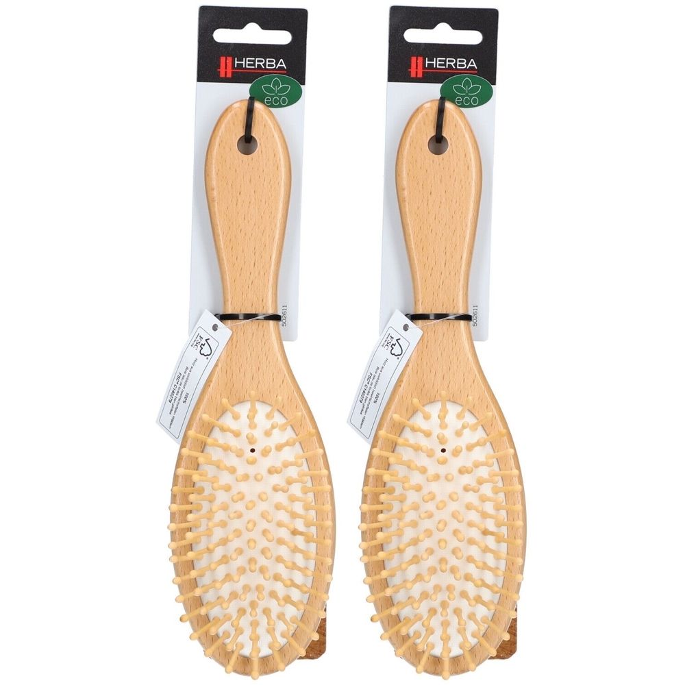 Deux brosses ovales en bois avec picots en bois. Poignées avec trou de suspension. Emballage avec logo de marque et label Eco.