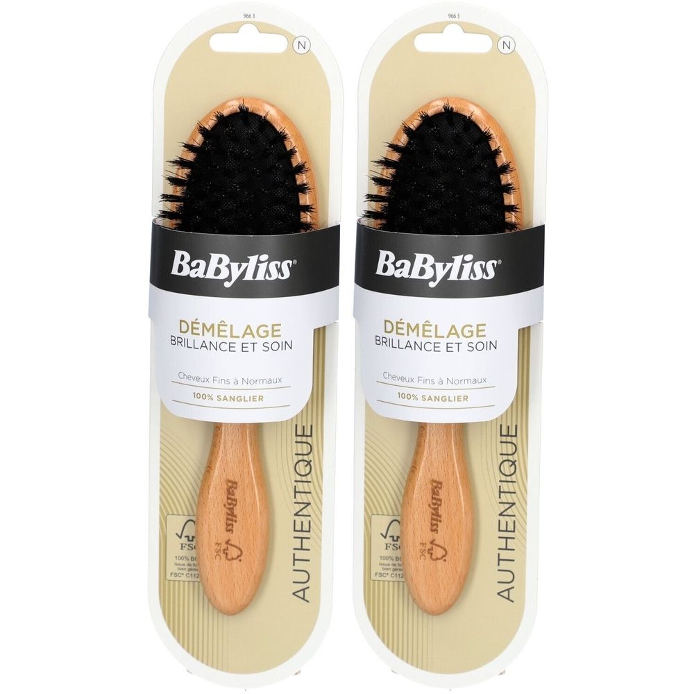 Twee BaByliss-haarborstels in verpakking. Ovale borstelkop met zwarte borstelharen, houten handvat. Opschrift: Démêlage Brillance et Soin.