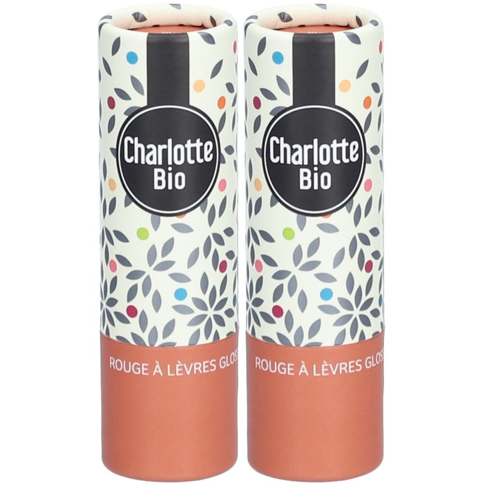 Deux emballages cylindriques. Inscription "Charlotte Bio". Partie inférieure marron, reste avec motif floral et points.