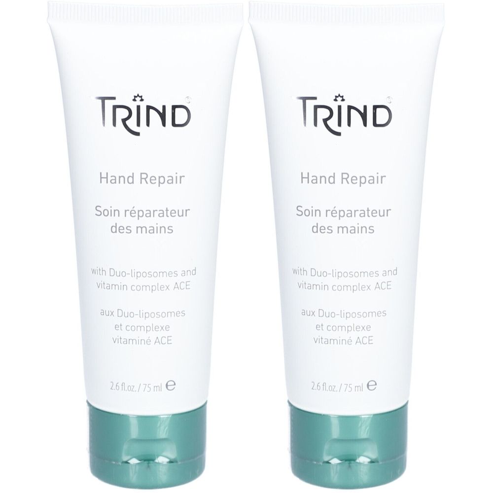 Twee tubes Hand Repair crème. Witte tubes met groene dop. Opschrift: TRIND, Hand Repair, Soin réparateur des mains.