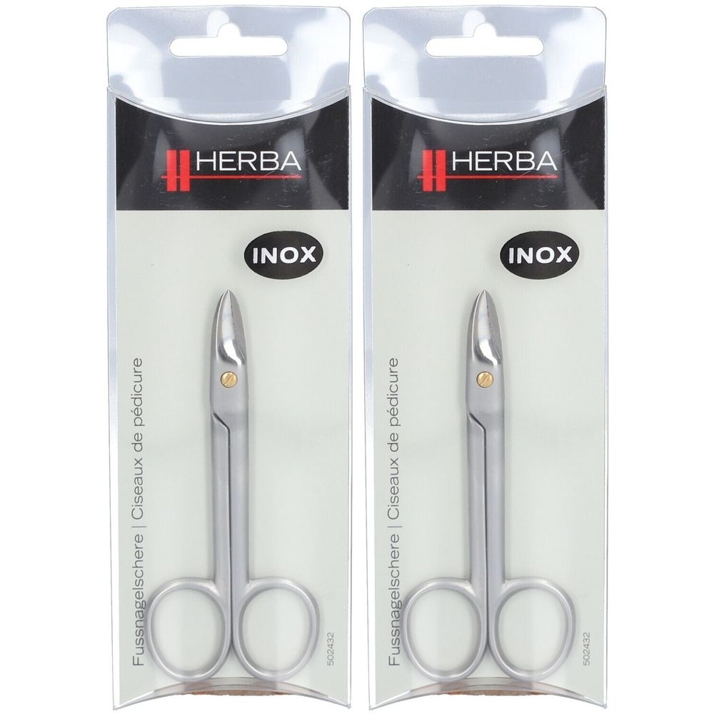 Deux ciseaux à ongles Herba® Inox en emballage. Acier inoxydable, lames incurvées, anneaux. Inscription : INOX, ciseaux à pédicure.