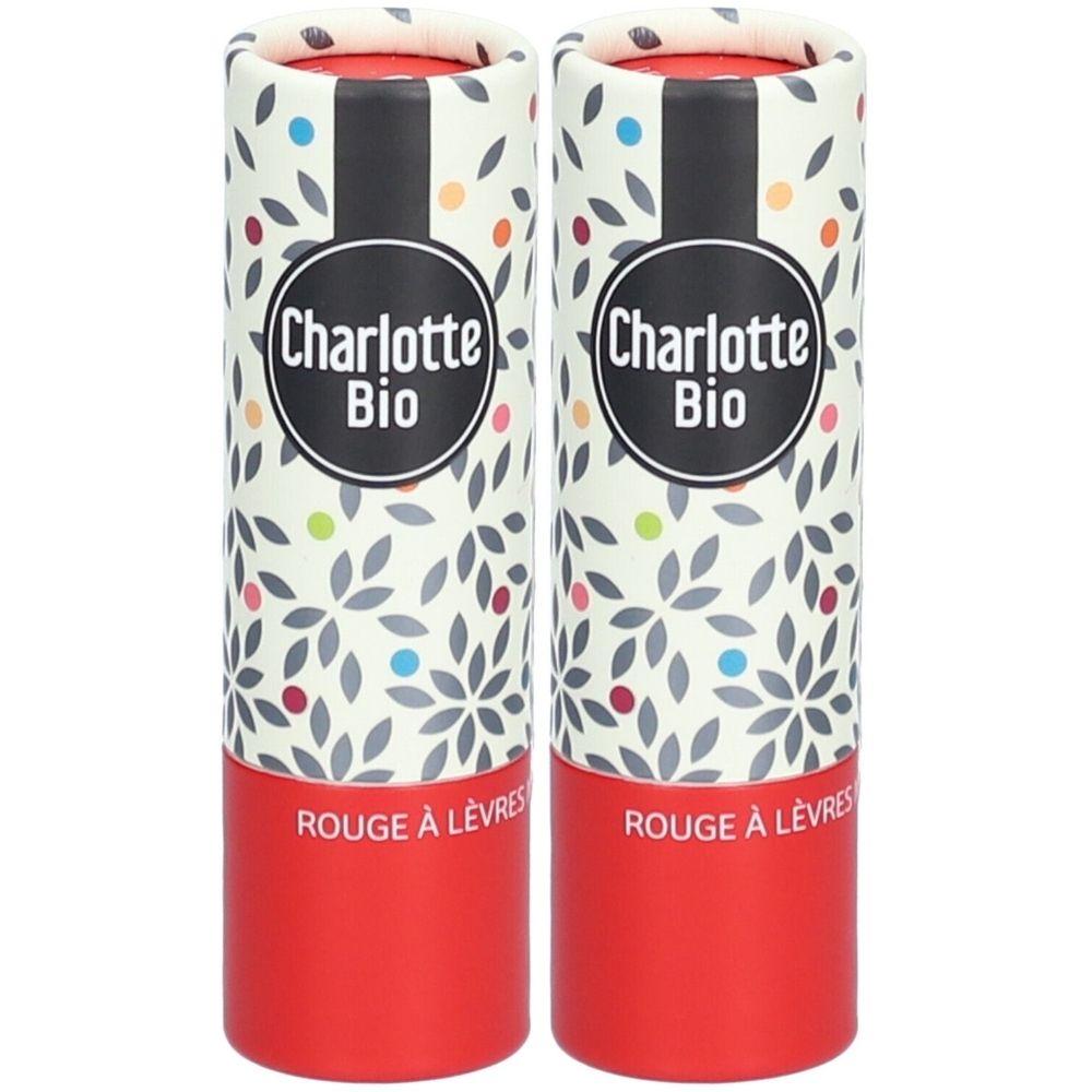 Twee cilindrische lippenstiftverpakkingen. Opschrift "Charlotte Bio" en "Rouge à Lèvres". Verpakking met bloemmotief en rode bodems.