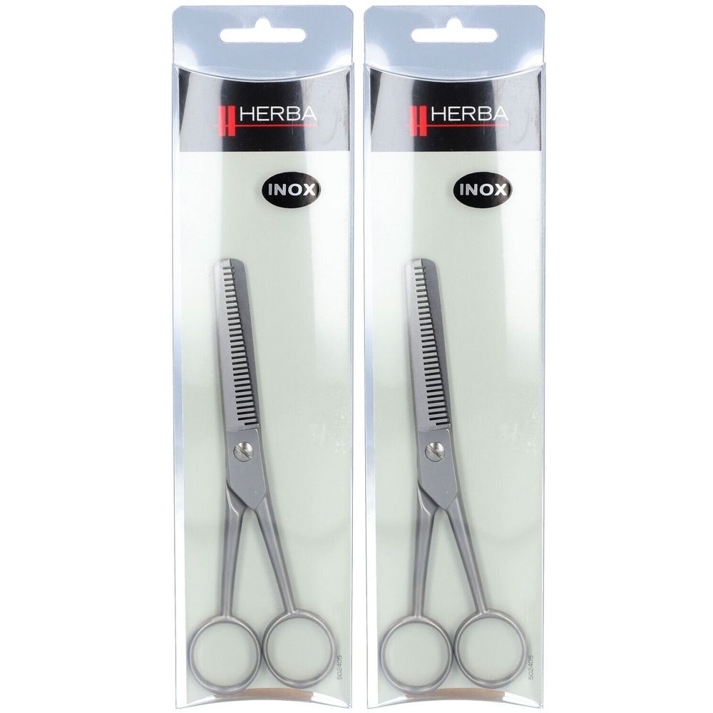 Twee effileerscharen in transparante verpakking. Merk Herba, Inox staal. Zichtbare gekartelde bladen.