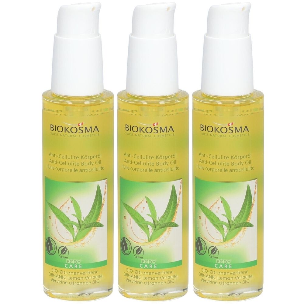 Drie flessen BIOKOSMA lichaamsolie. Witte pompkopjes, gele olie. Opschrift: Anti-Cellulite Body Oil, BIO Lemon Verbena.