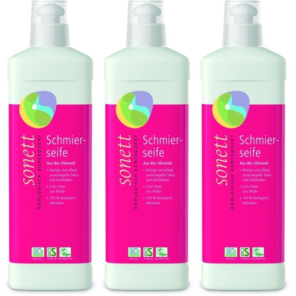 Trois flacons avec bouchon blanc et étiquette rose. Inscription : sonett Schmierseife. Avec logo et certifications.