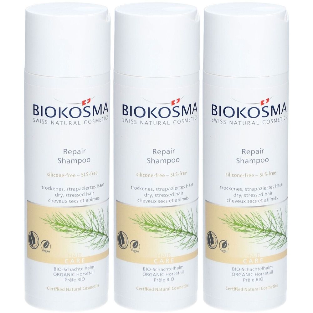 Drie witte shampoo flessen met BIOKOSMA logo. Opschrift: Repair Shampoo, voor droog, beschadigd haar. Met bio-keurmerk.