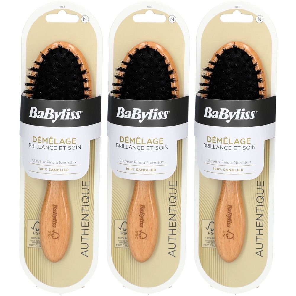 Drie BaByliss houten borstels in verpakking. Zwarte borstelharen, houten handvat. Opschrift: Démêlage Brillance et Soin. 100% Sanglier.
