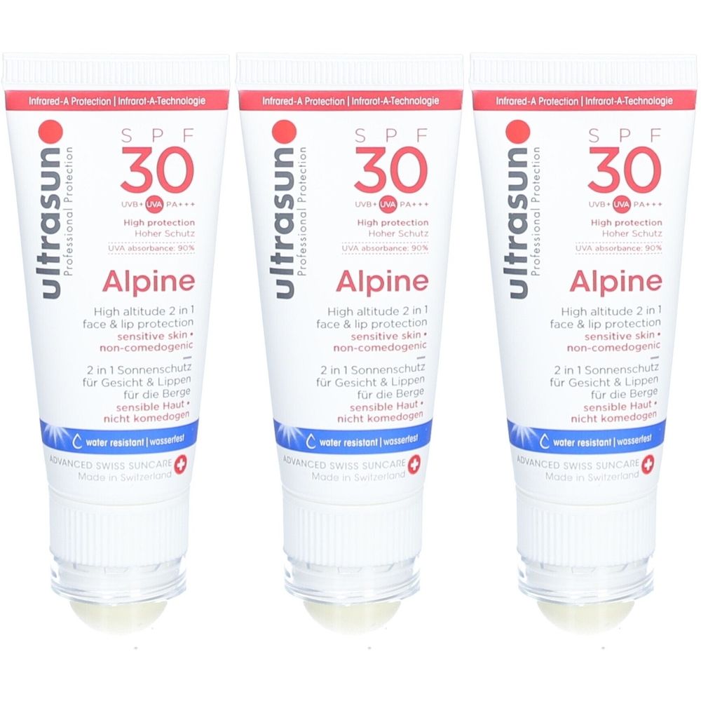 Drie tubes Ultrasun Alpine zonnebrandcrème SPF 30. Wit-blauwe verpakking met rode tekst. Bevat 'High altitude 2 in 1 face & lip protection'.