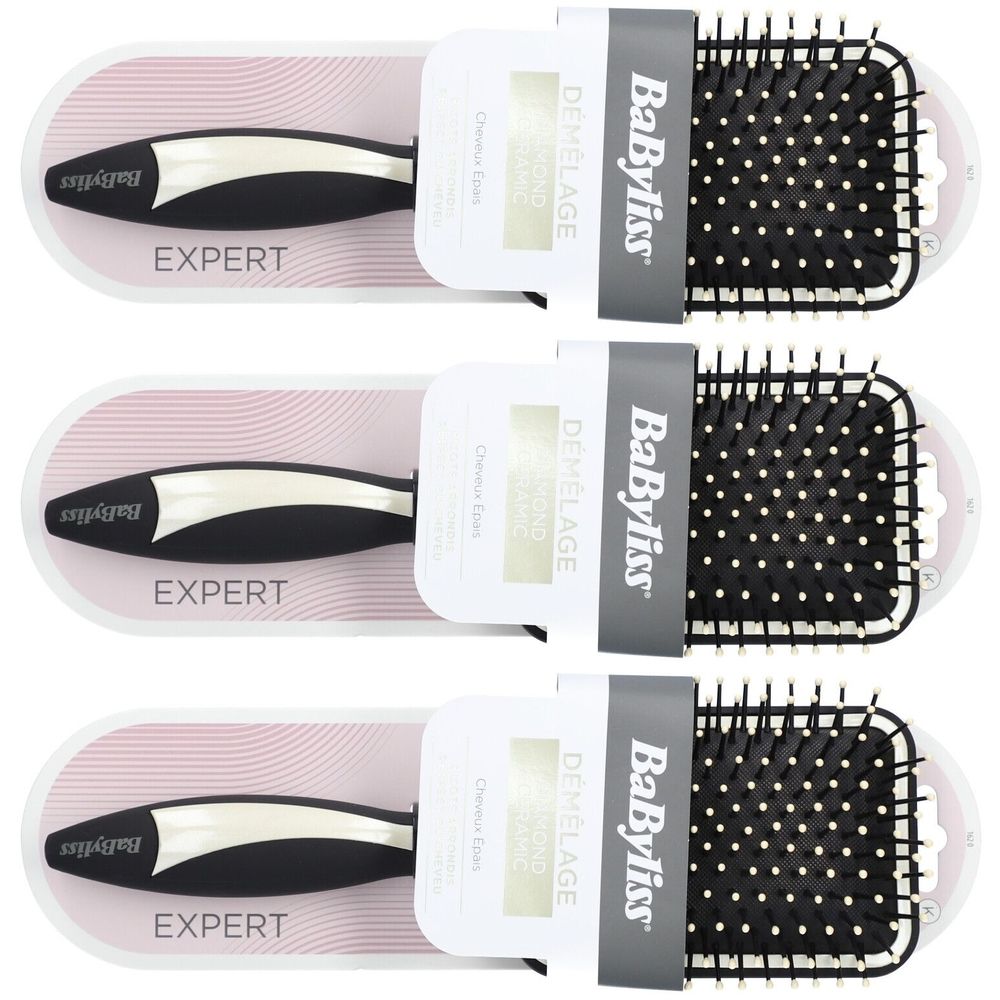 Drie haarborstels in verpakking. Zwarte handgreep, grijze borstelkop met witte noppen. Merk BaByliss, opschrift EXPERT.