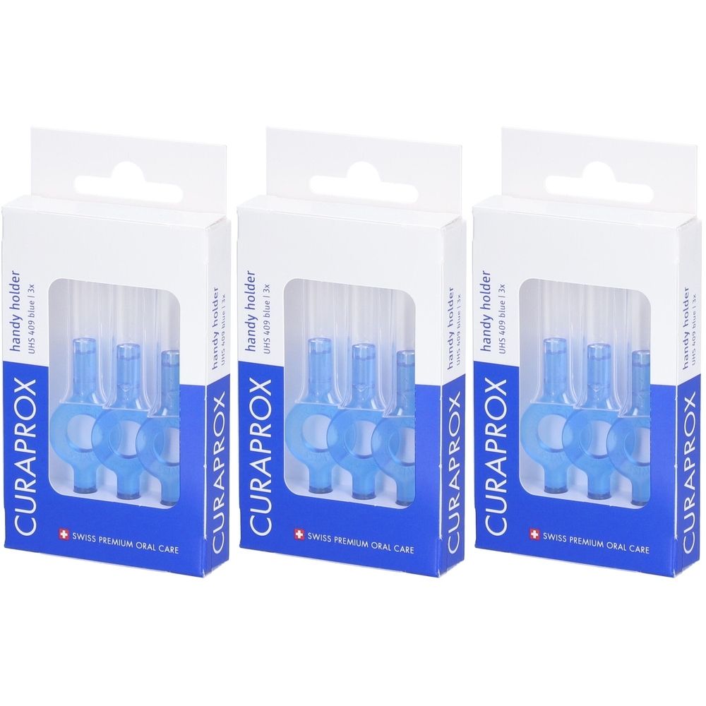 Drie verpakkingen met blauwe interdentale borstelhouders. De verpakking toont de merknaam CURAPROX en de tekst "handy holder".