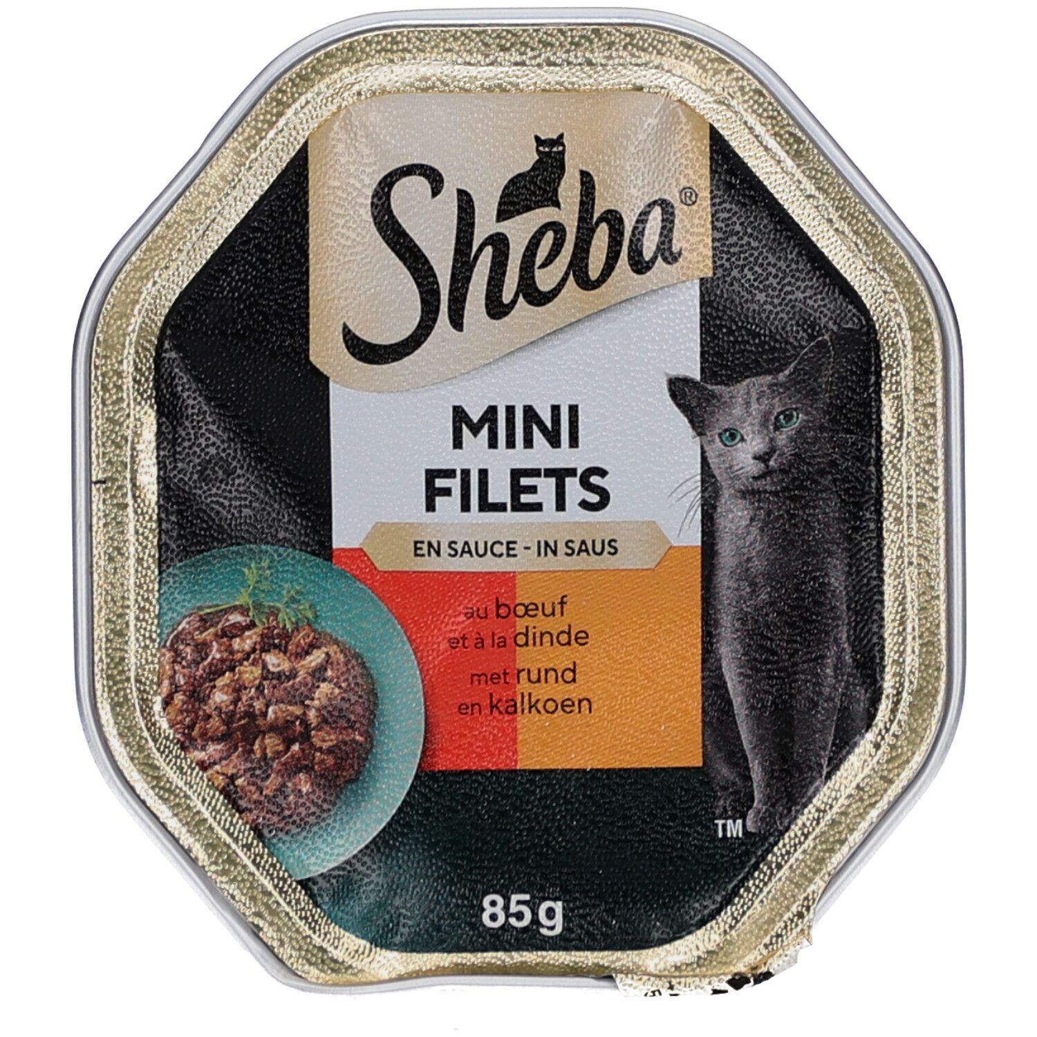 Geopende achthoekige bak met kattenvoer. Opschrift: Sheba, Mini Filets, kat, tekst. 85g.