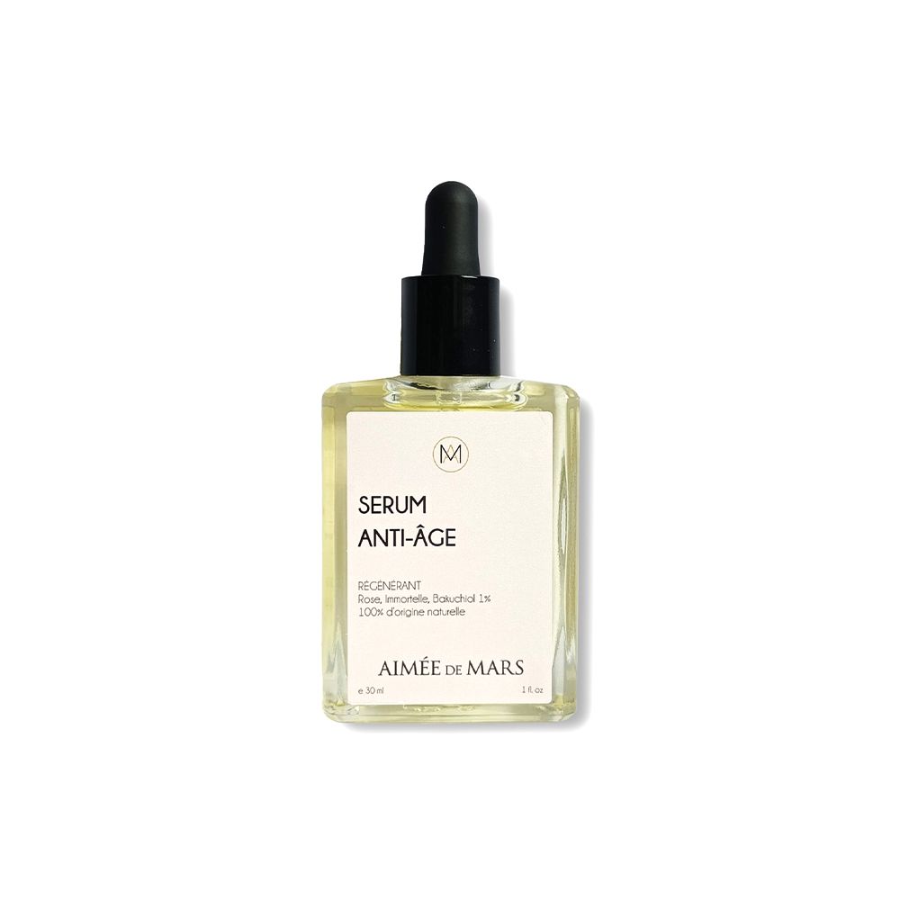 Transparante glazen fles met zwarte pipet. Label met "SERUM ANTI-ÂGE" en "AIMÉE DE MARS".