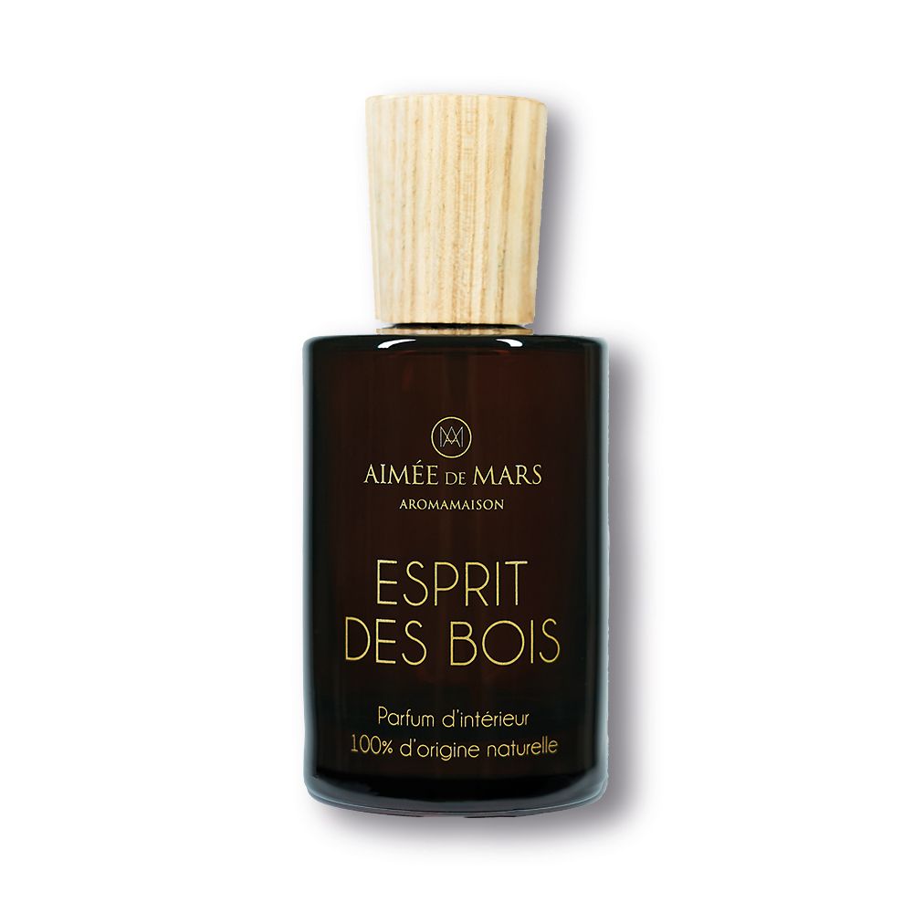 Flacon en verre brun avec bouchon en bois. Inscription: Esprit des Bois, Parfum d'intérieur, 100% d'origine naturelle.