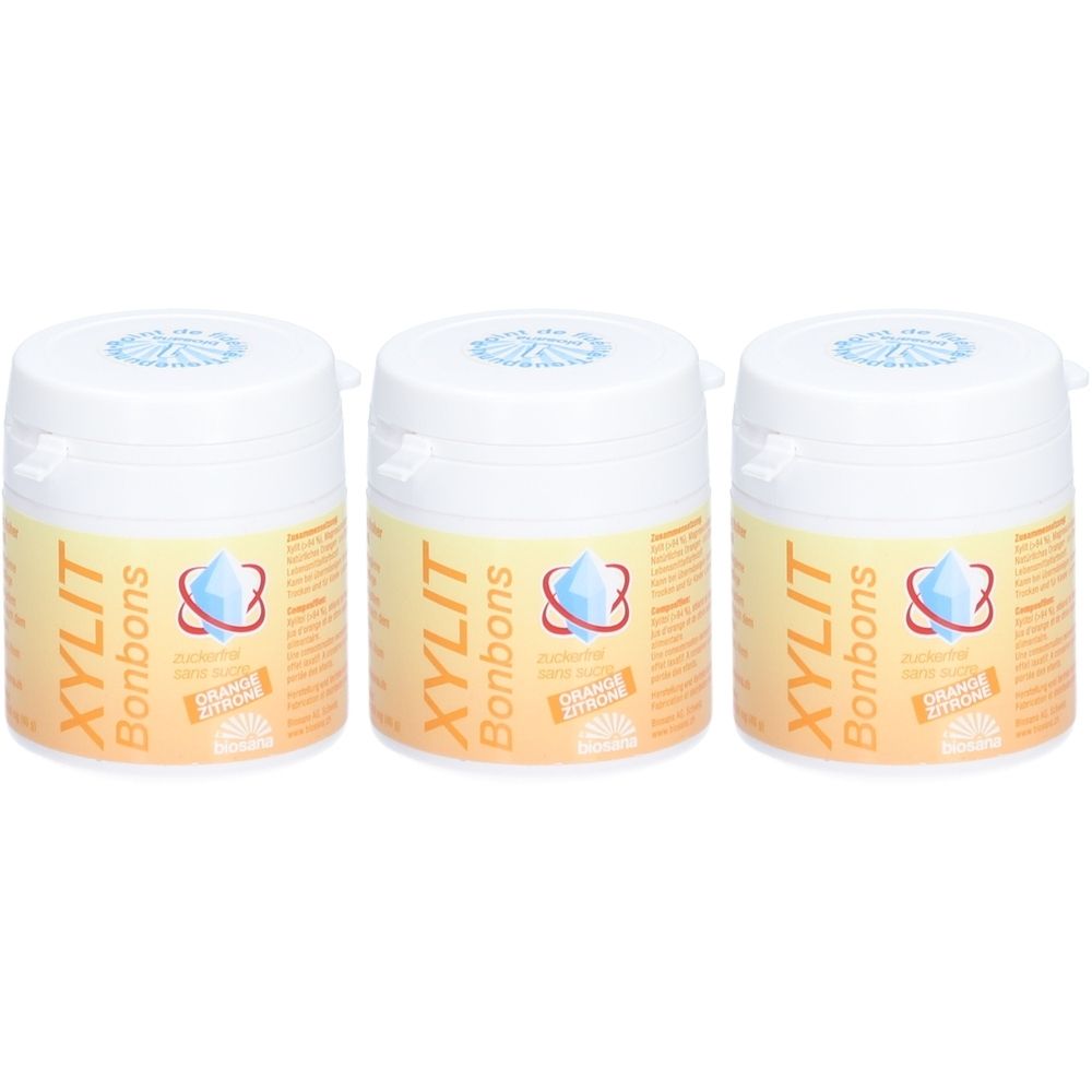 Trois contenants de pastilles XYLIT Orange/Citron. Contenants blancs avec étiquette orange-jaune.