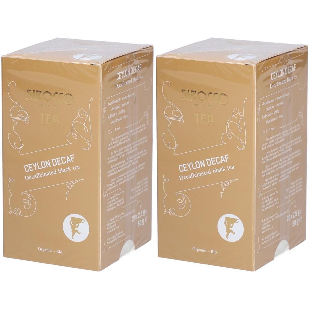 Twee goudkleurige dozen met opschrift "Ceylon Decaf". Zichtbaar: logo, tekst en bio-label.
