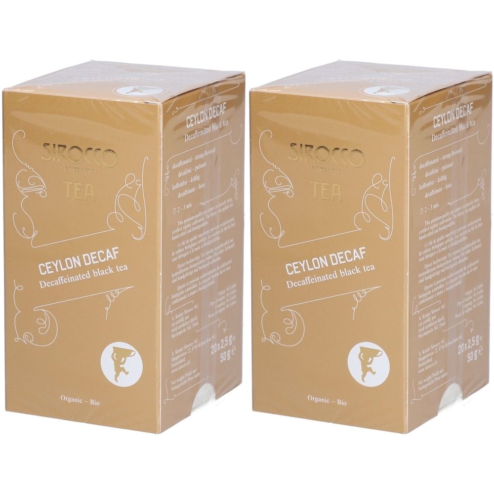 Deux boîtes dorées avec l'inscription "Ceylon Decaf". Visibles : logo, texte et label bio.