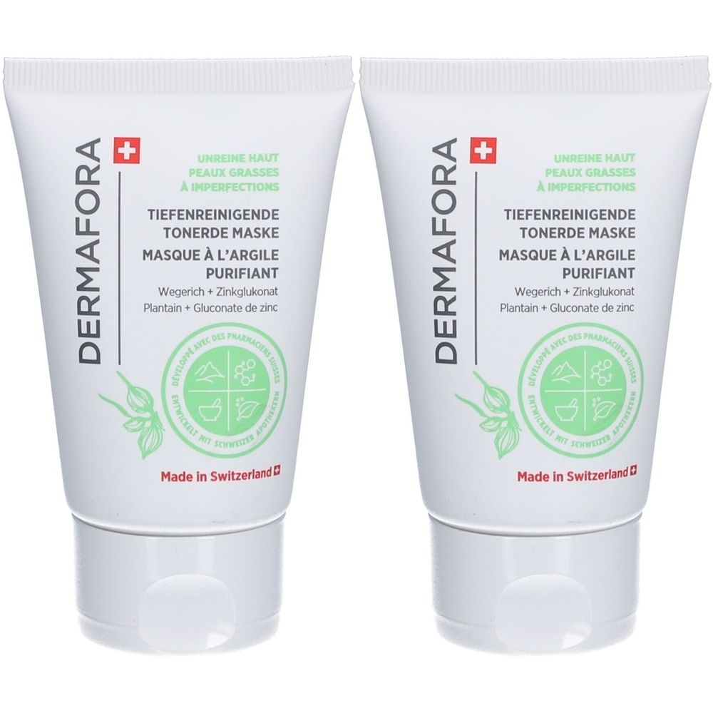 Twee witte tubes met groene tekst en DERMAFORA logo. Tekst: Diepreinigend kleimasker. Gemaakt in Zwitserland.
