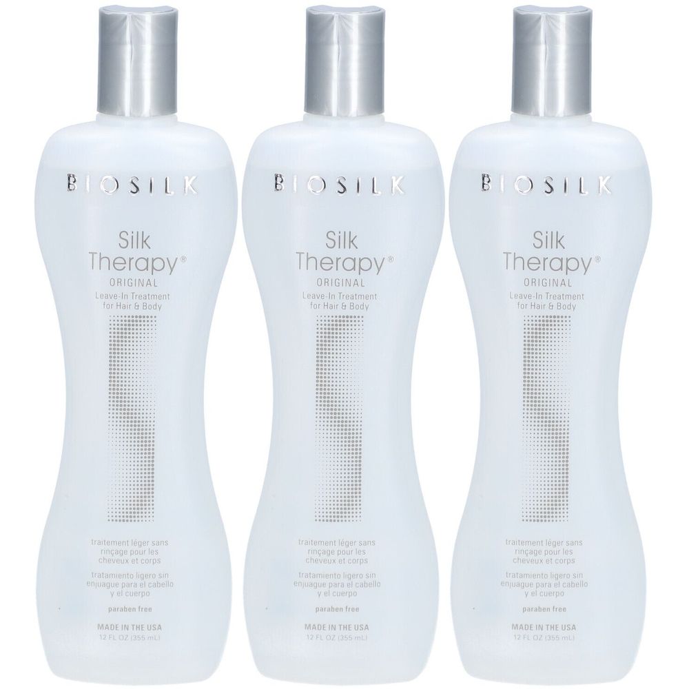 Drie flessen BioSilk Silk Therapy Original. Witte flessen met zilveren doppen. Tekst: Silk Therapy Original, Leave-in Treatment.