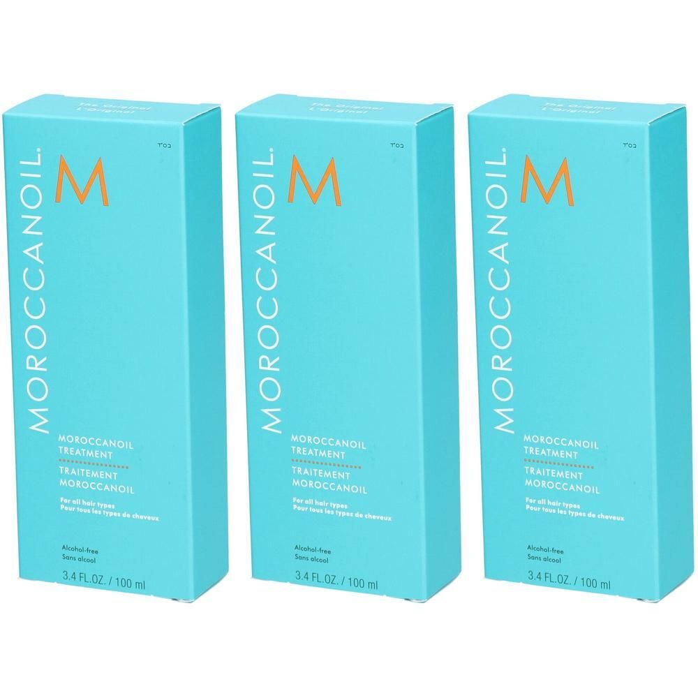 Drie pakken Moroccanoil Treatment Original, turkoois met oranje 'M'-logo.