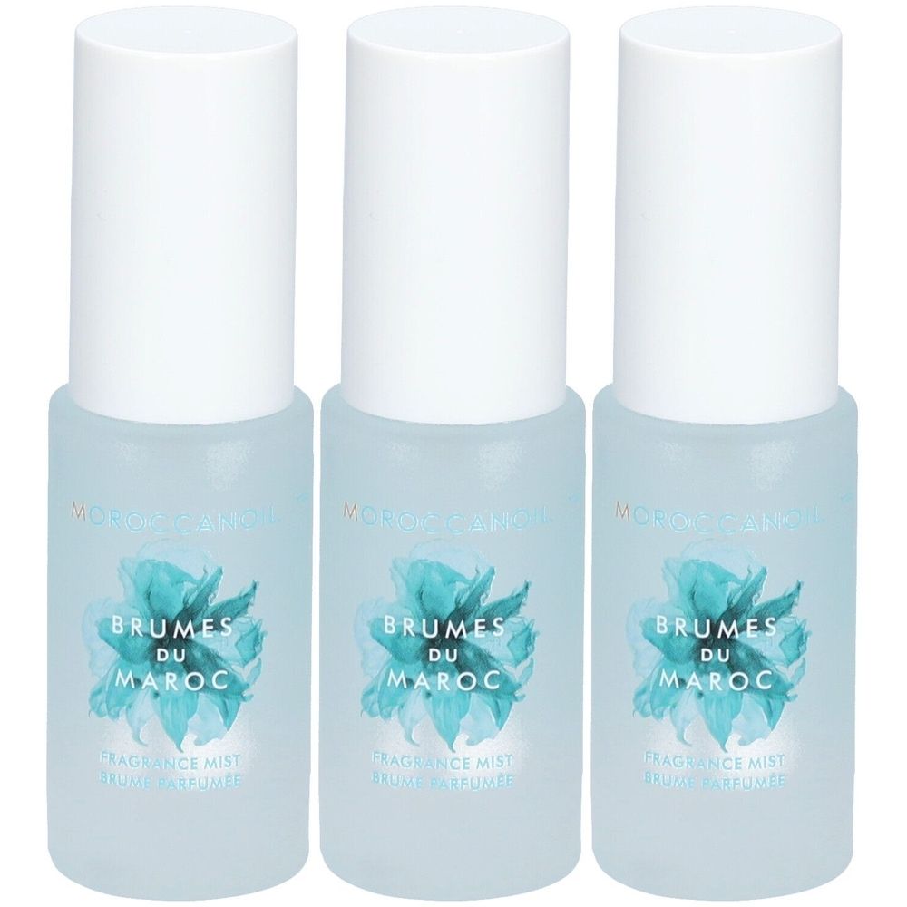 Trois flacons de Moroccanoil Brumes du Maroc avec bouchon blanc et étiquette bleue.