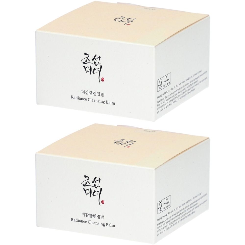 Twee vierkante dozen met crèmekleurige deksels. Koreaanse tekst en "Radiance Cleansing Balm" op de voorkant. Certificatiemerk op de zijkant.