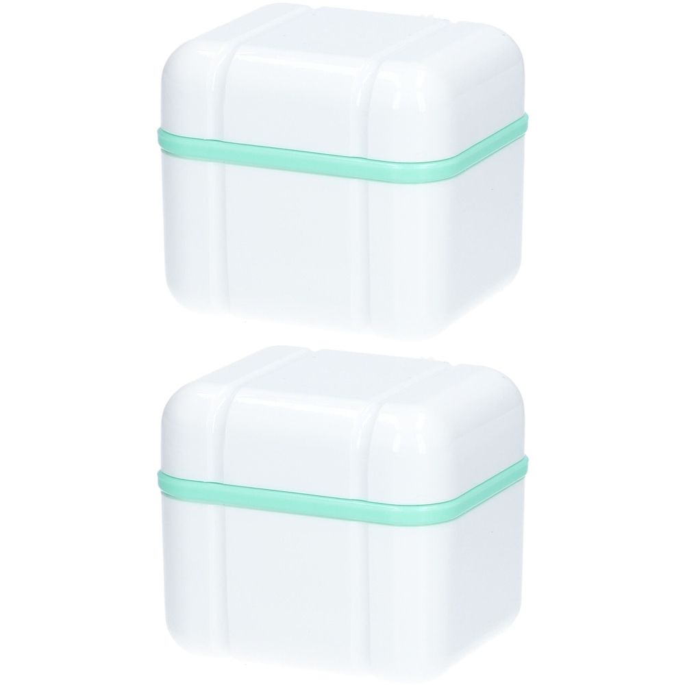 Twee witte, vierkante dozen met mintgroene randen. Deksel met afgeronde hoeken.