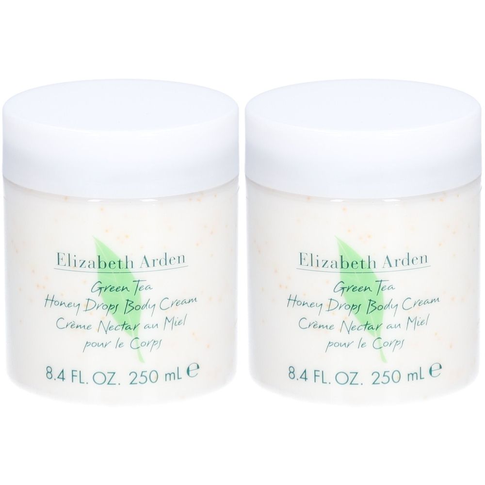 Deux pots blancs de crème pour le corps avec couvercles. Inscription: Elizabeth Arden, Green Tea, Honey Drops Body Cream. 8.4 FL. OZ. 250 ml e.