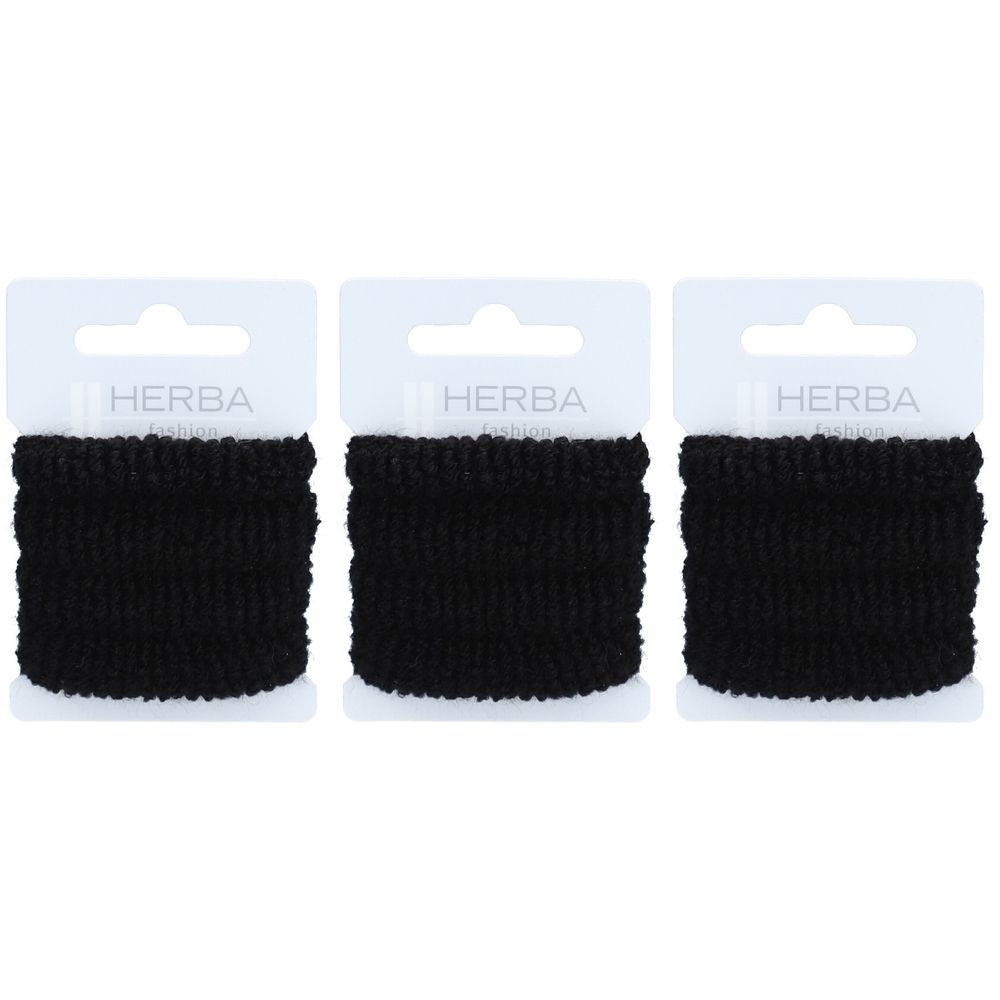 Trois élastiques noirs sur carton blanc. Logo HERBA en haut. Texture tissée, enroulée.
