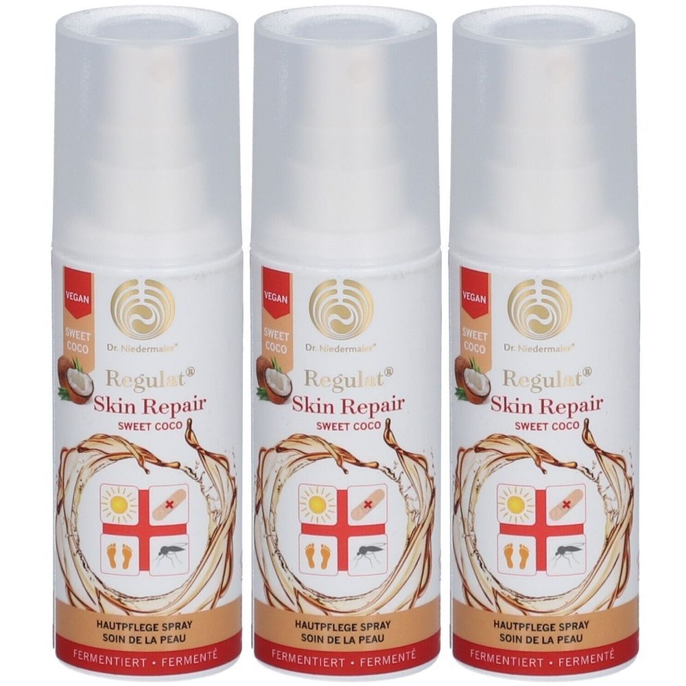 Trois flacons de spray blancs avec bouchons transparents. Inscription: Regulat Skin Repair Sweet Coco. Label végétalien.