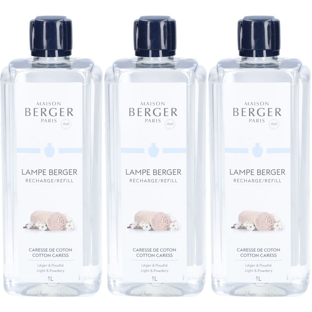 Trois flacons Maison Berger Paris. Inscription : Lampe Berger, Caresse de Coton, 1L. Bouchon bleu, flacon transparent.