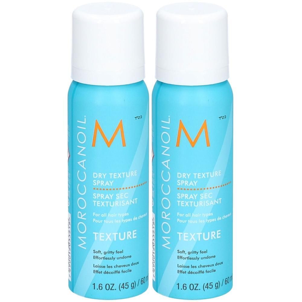 Twee Moroccanoil Dry Texture Spray flacons, lichtblauw met witte dop.