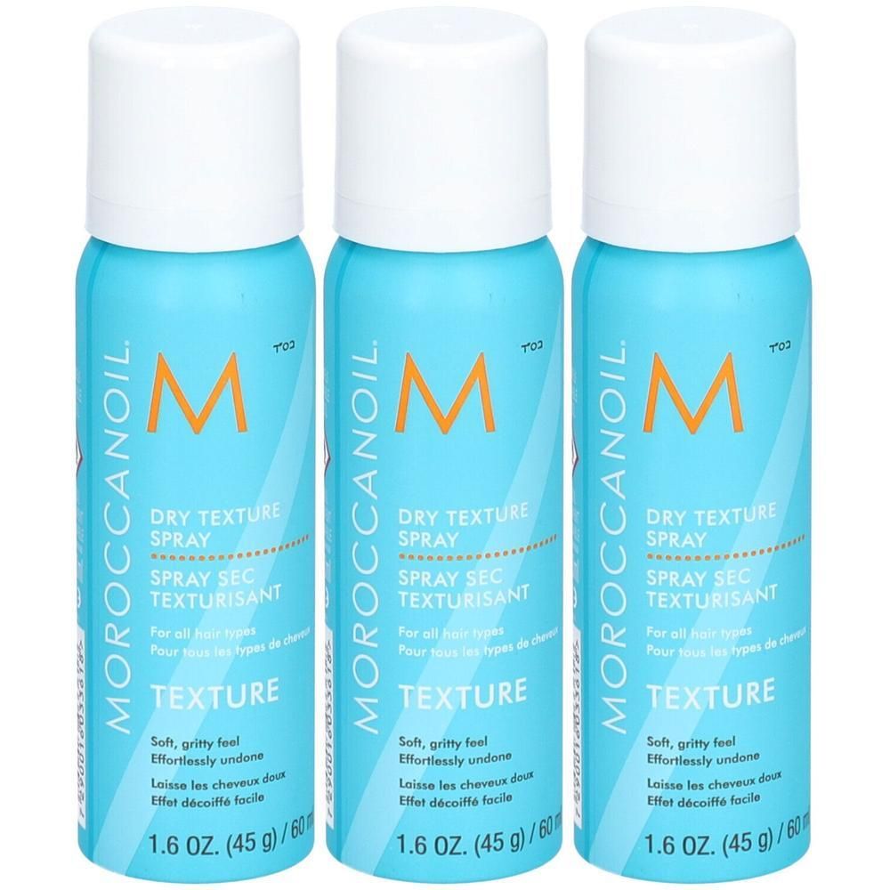 Drie Moroccanoil Dry Texture Spray flacons in turquoise met witte dop. Tekst: DRY TEXTURE SPRAY.