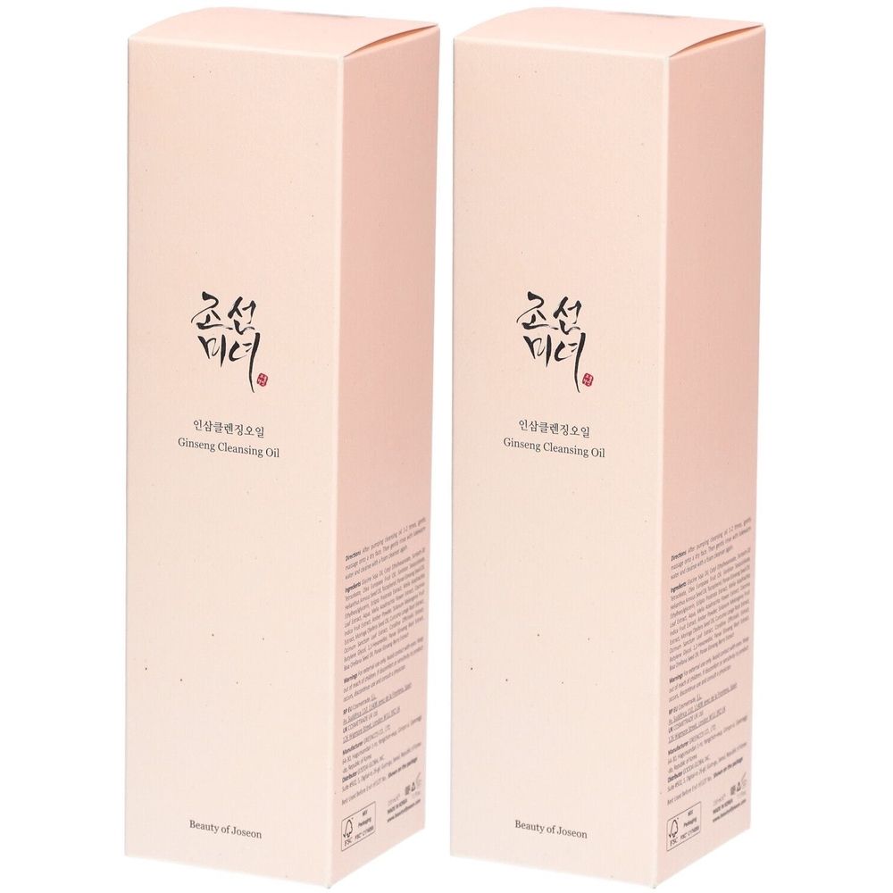Twee roze rechthoekige productverpakkingen. Op de voorkant staan tekens en de tekst "Ginseng Cleansing Oil". Merknaam zichtbaar.