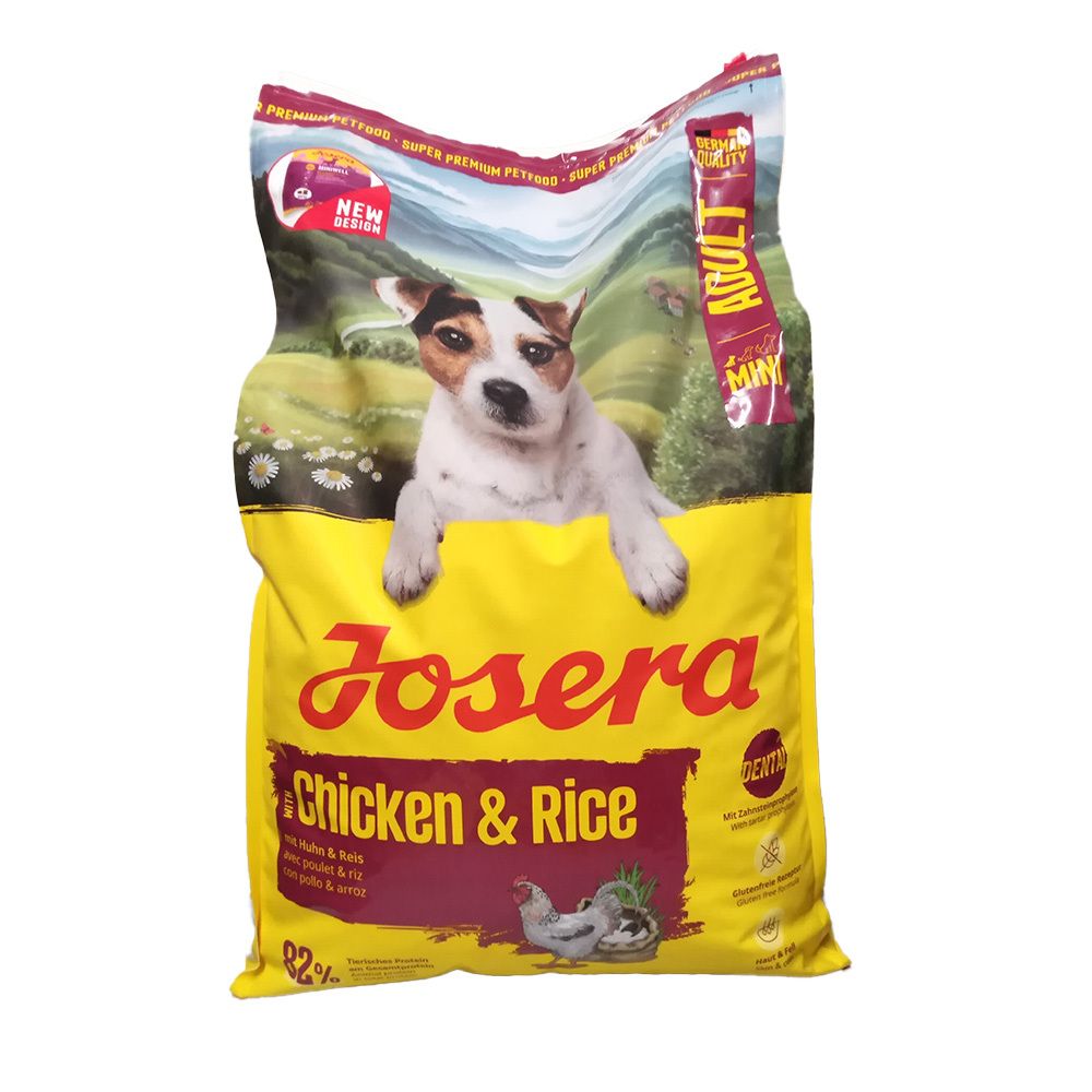 Achterkant van een Josera Chicken & Rice hondenvoer verpakking met voedingswaarden en voedingstabel.