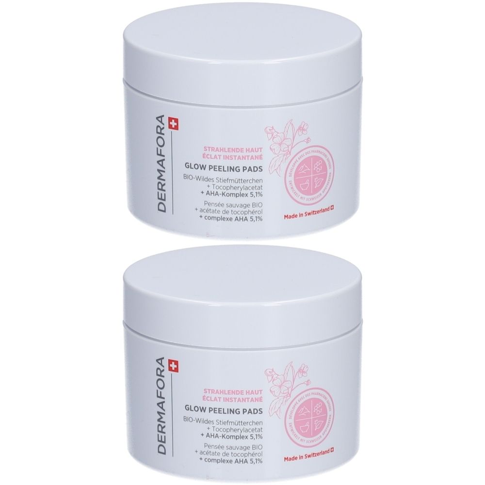 Deux pots blancs avec couvercles. Inscription: Dermafora, Glow Peeling Pads. Logo et texte roses. Fabriqué en Suisse.