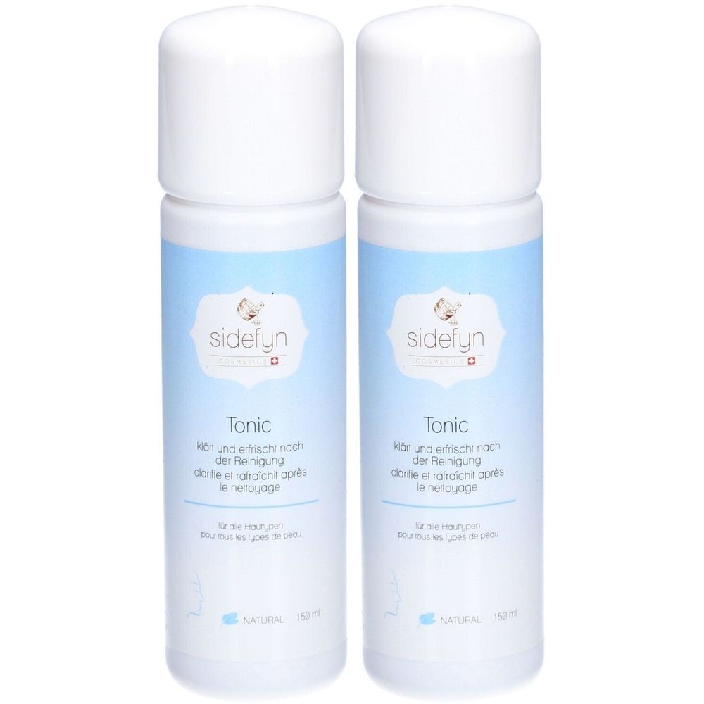 Twee witte flessen met blauw etiket. Op het etiket staat "sidefyn Tonic". Tekst in het Duits en Frans.