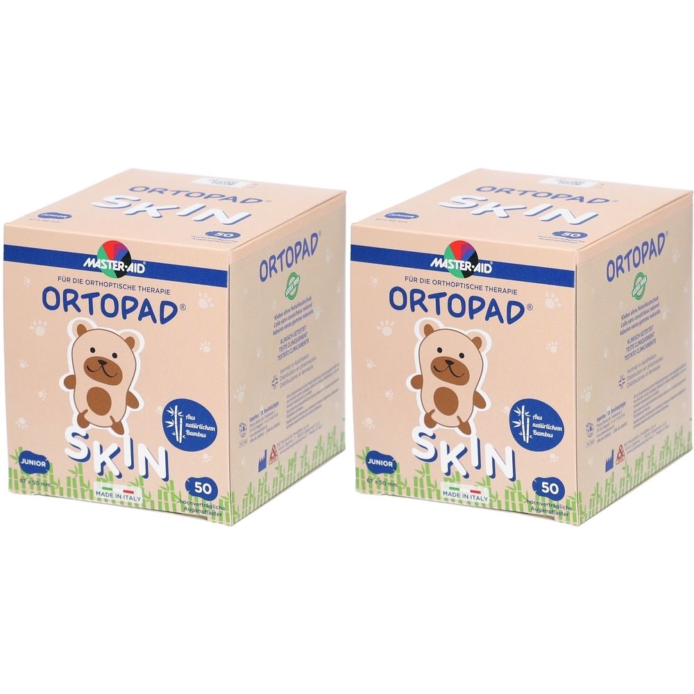 Deux paquets de pansements oculaires Ortopad Junior Skin, 50 pièces chacun. Boîte en carton avec motif d'ours.