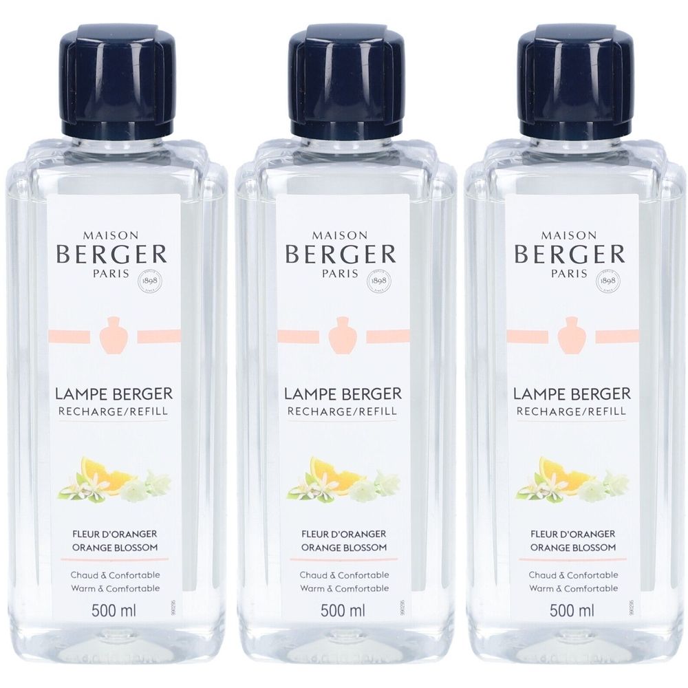 Trois flacons de parfum d'ambiance Lampe Berger® Fleur d'Oranger. Bouteilles claires, rectangulaires, avec bouchon noir. Étiquette avec logo, nom et contenu.