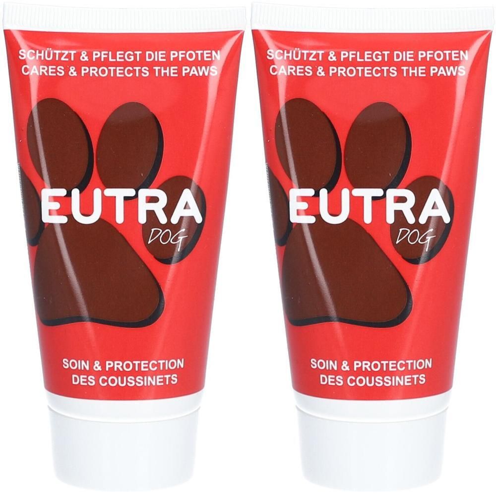 Deux tubes de Eutra Dog. Pommade pour pattes de chien avec motif empreinte de patte. Emballage rouge avec bouchon blanc.
