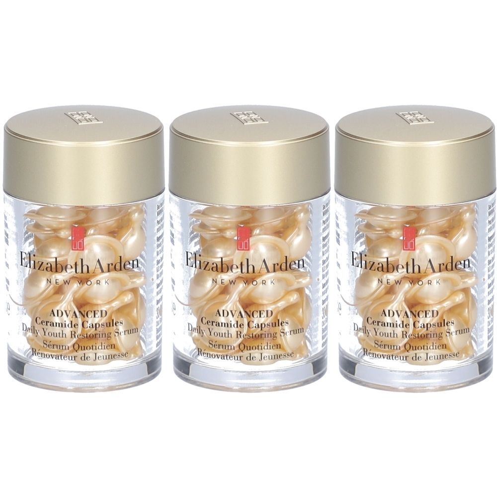 Drie transparante potjes met gouden deksels. Elk potje bevat goudkleurige capsules. Op elk potje staat "Elizabeth Arden".
