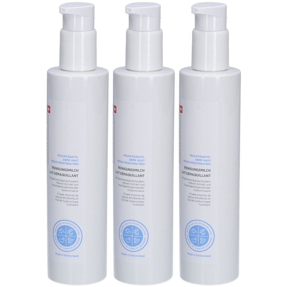 Trois flacons blancs avec pompe. Inscription: Reinigungsmilch, Lait démaquillant. Drapeau suisse. Cercles bleus avec symboles.