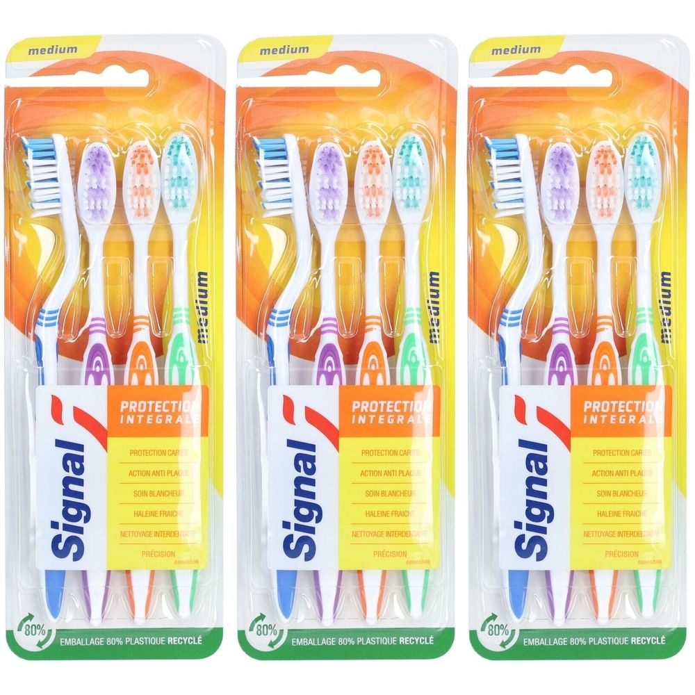 Trois emballages de brosses à dents. Chaque emballage contient quatre brosses à dents de couleurs différentes. Le mot "Signal" est visible.